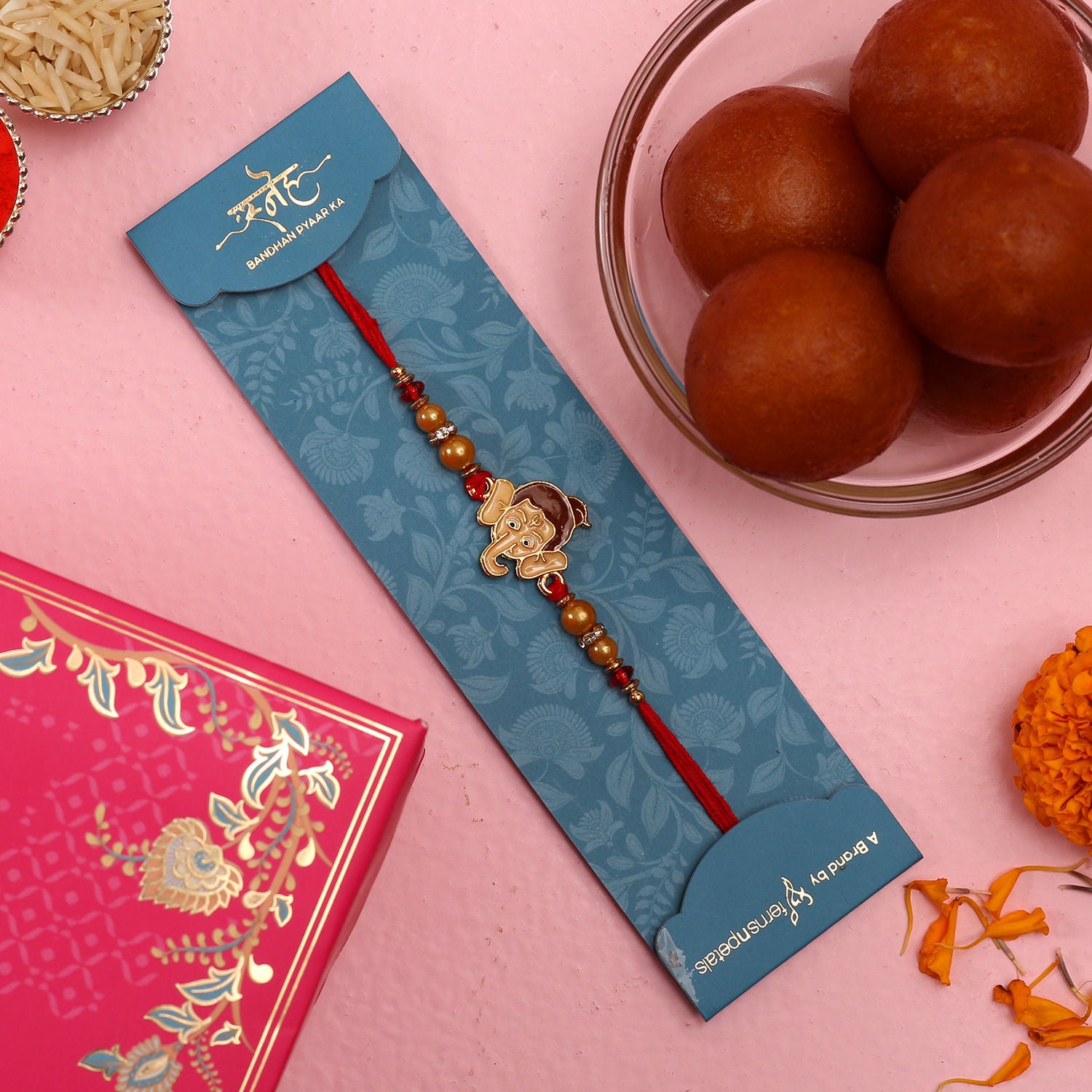 Ganesha Face Kids Rakhi And Gulab Jamun