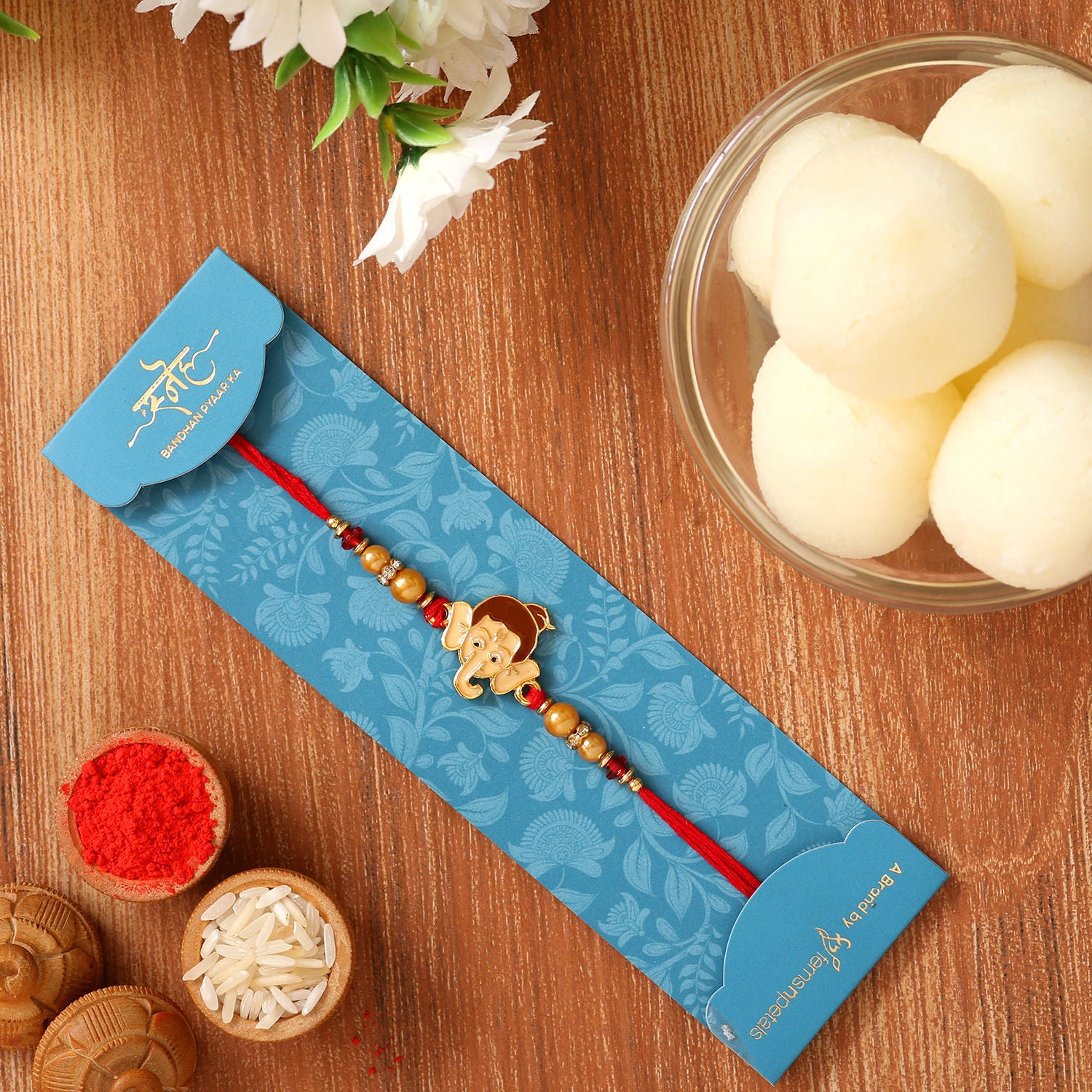 Ganesha Face Kids Rakhi And Rasgulla