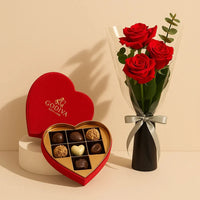 طقم هدية أنيق من الورد الأحمر مع قلب شوكولاتة جوديفا
