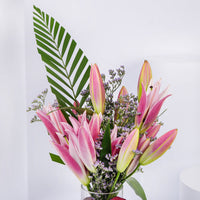 Elegant Grand Pink Petals Arrangement in Glass Vase