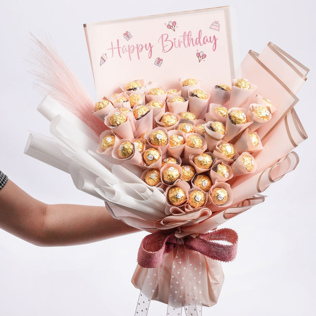 باقة عيد ميلاد فاخرة مع لمسة فيريرو روشيه وبامباس