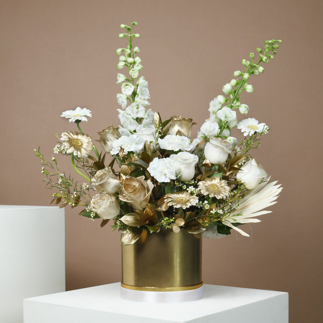 Harmonious Flowers: Elegant White Floral Arrangement in a Gold Round Box