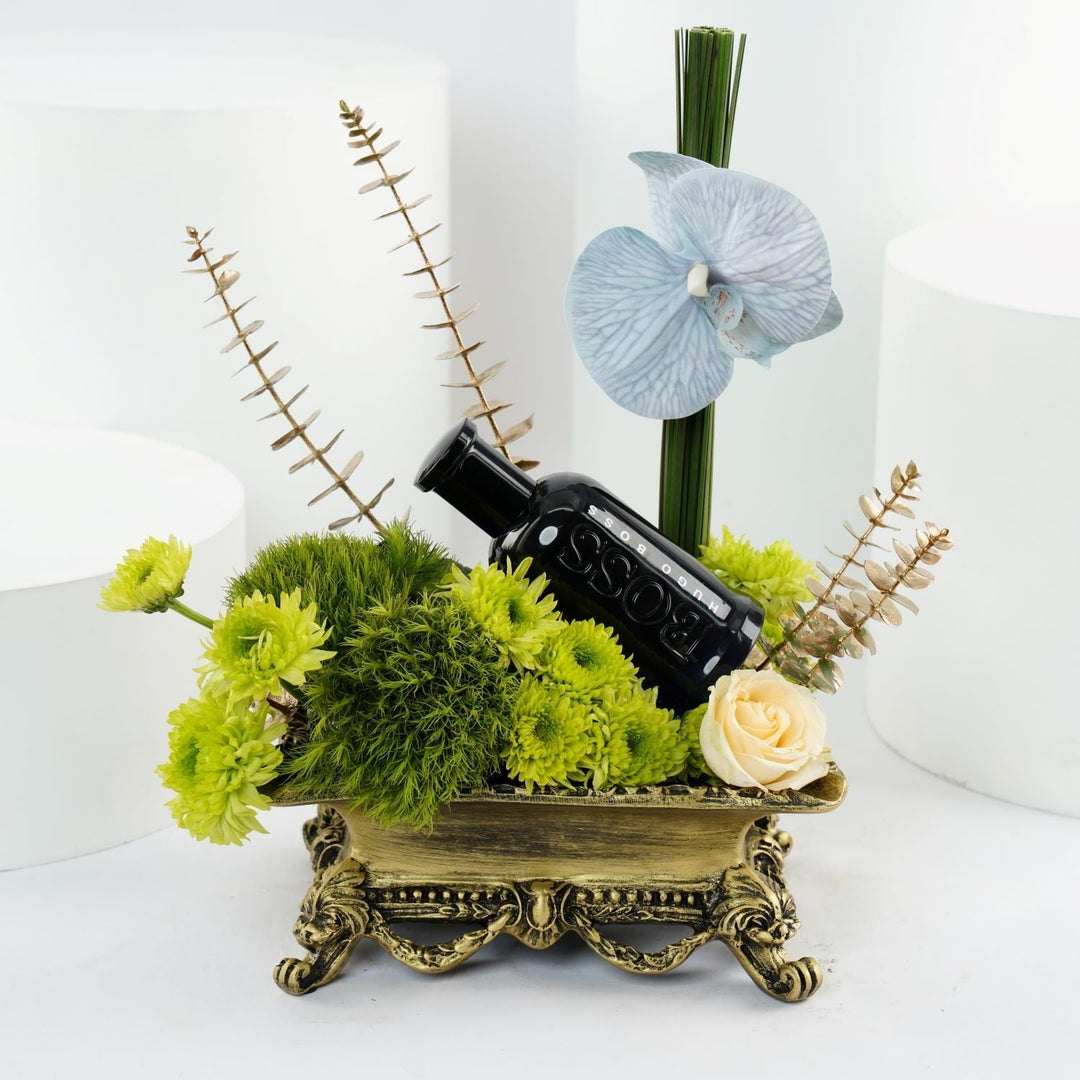 Hugo Boss Men's Perfume with Elegant Floral Arrangement on Ornate Resin Tray