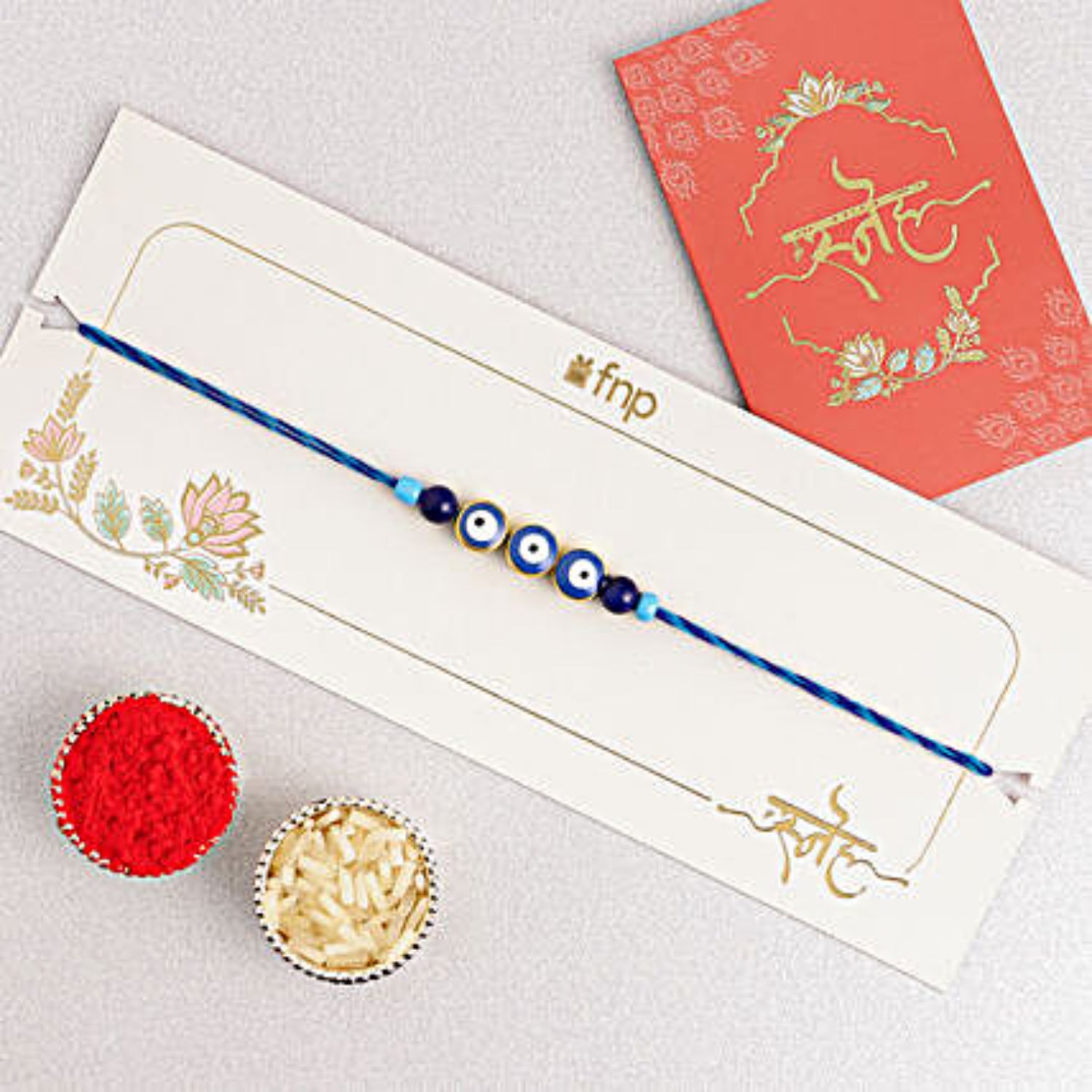 Minimalistic Navy Evil Eye Rakhi N Butterscotch Delight Half Kg