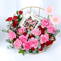 Elegant Metal Stand Arrangement with Mixed Flowers and Gourmet Chocolates