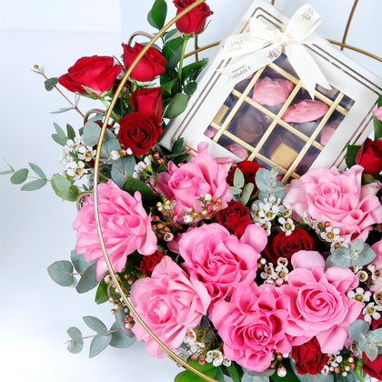 Elegant Metal Stand Arrangement with Mixed Flowers and Gourmet Chocolates