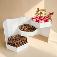 احتفال عيد ميلاد رائع: ورود بلونين وشوكولاتة فاخرة