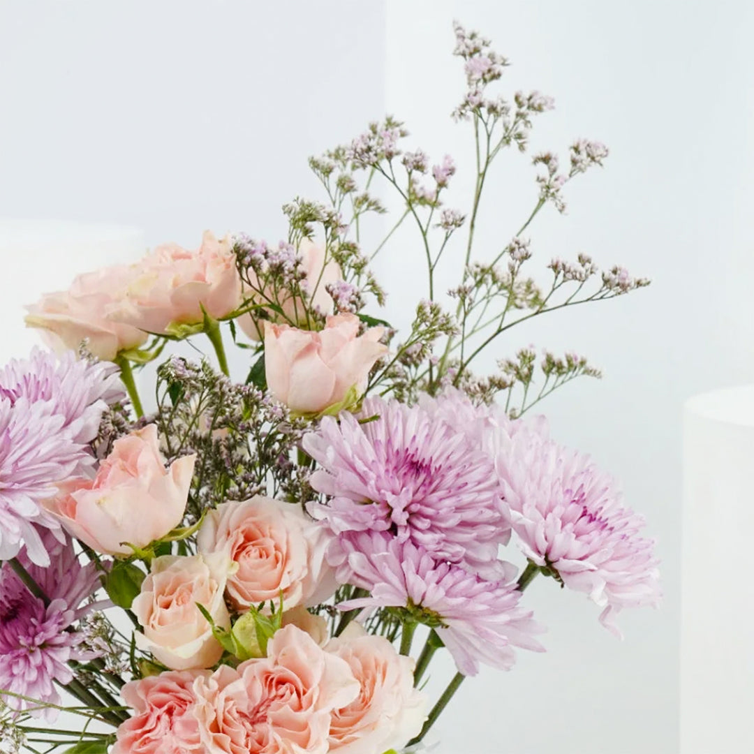 Radiant Femme Sphere: Elegant Floral Arrangement in Fish Bowl