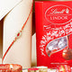 Elegant Red Gemstone Mauli Rakhi with Lindt Lindor Chocolate Combo
