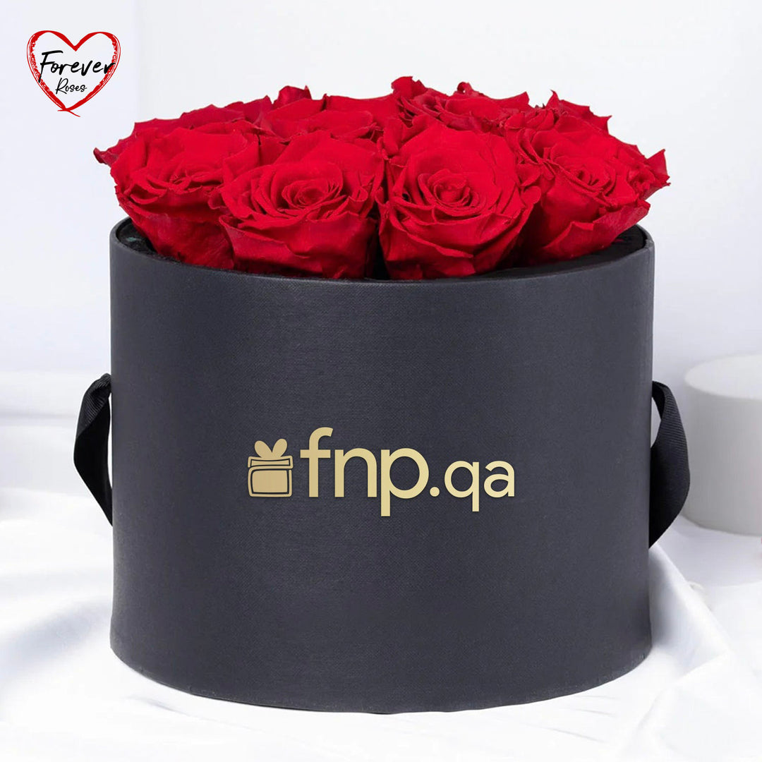 أزهار من القلب – 12 وردة وردية أبدية فاخرة في علبة سوداء أنيقة