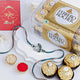 Exquisite Sapphire Serenity Peacock Rakhi with Ferrero Rocher Delight