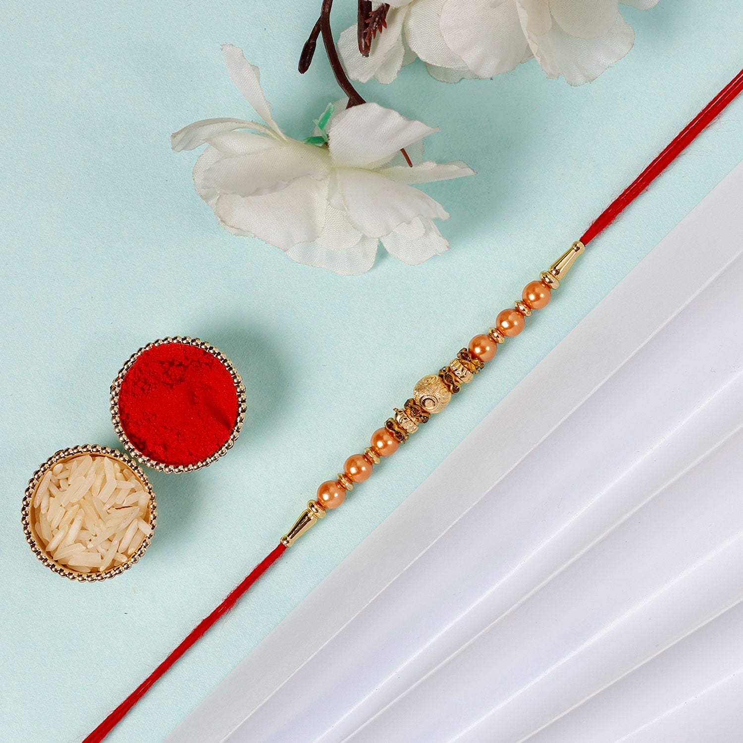 Sneh Rose Gold Rakhi & Ferrero Rocher