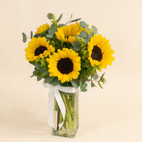 Sunflowers Arranged In A Clear Glass Vase