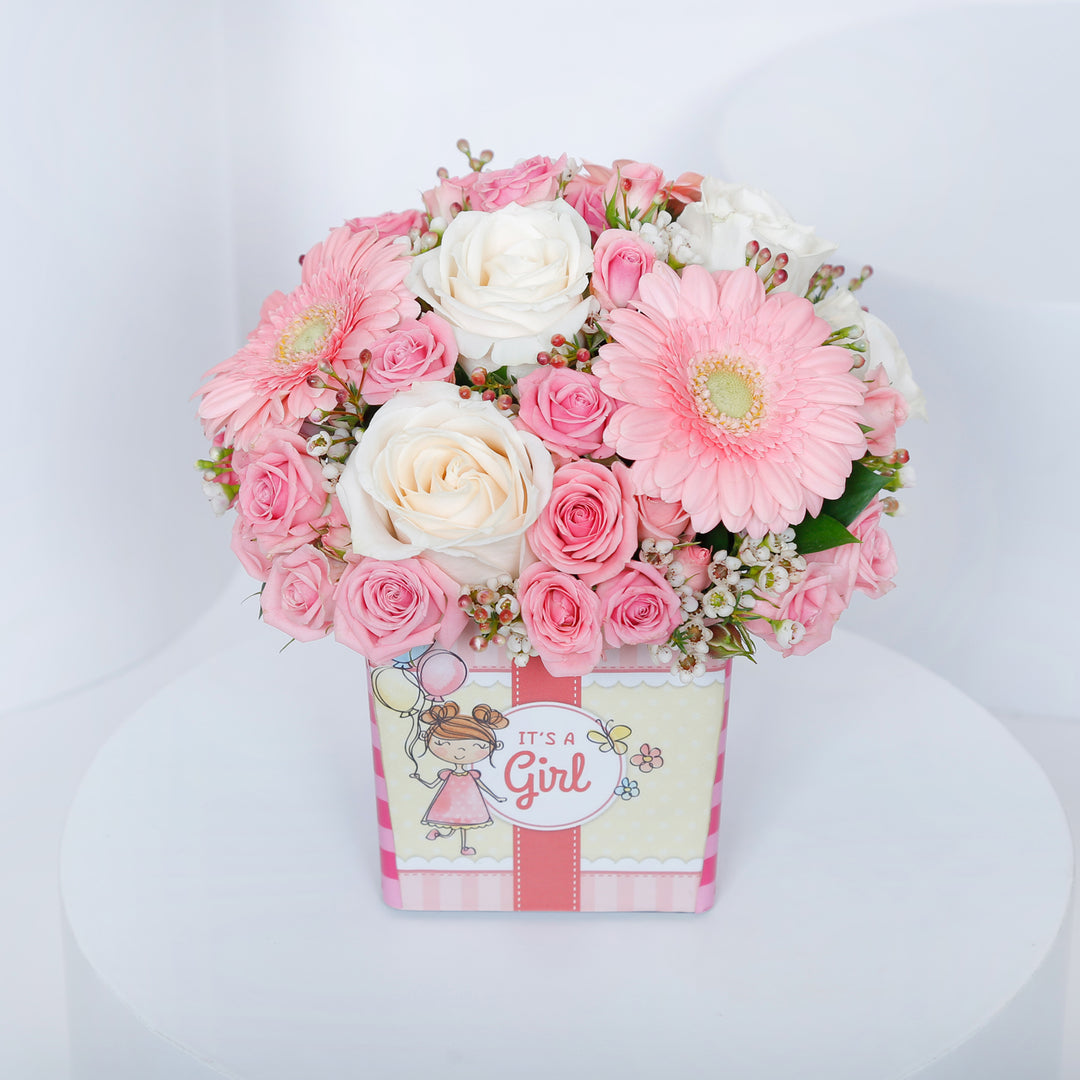 Charming Welcome Baby Girl Floral Arrangement in Square Vase