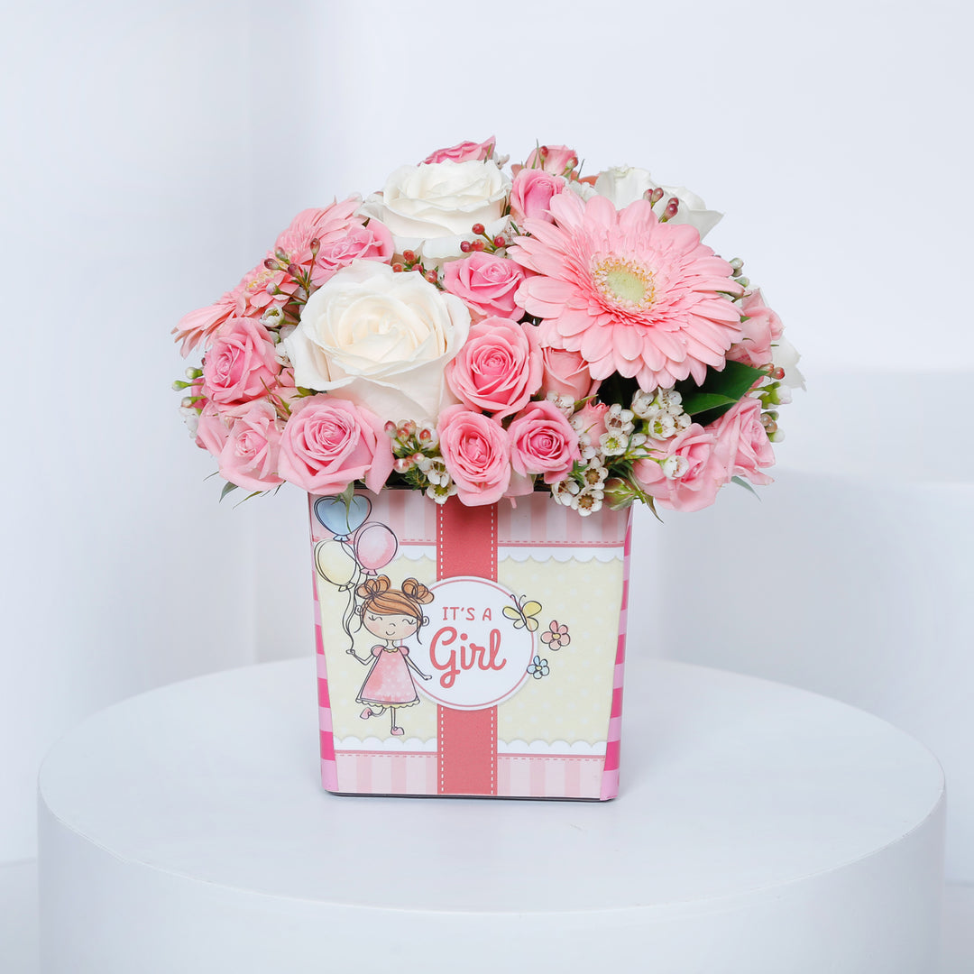 Charming Welcome Baby Girl Floral Arrangement in Square Vase
