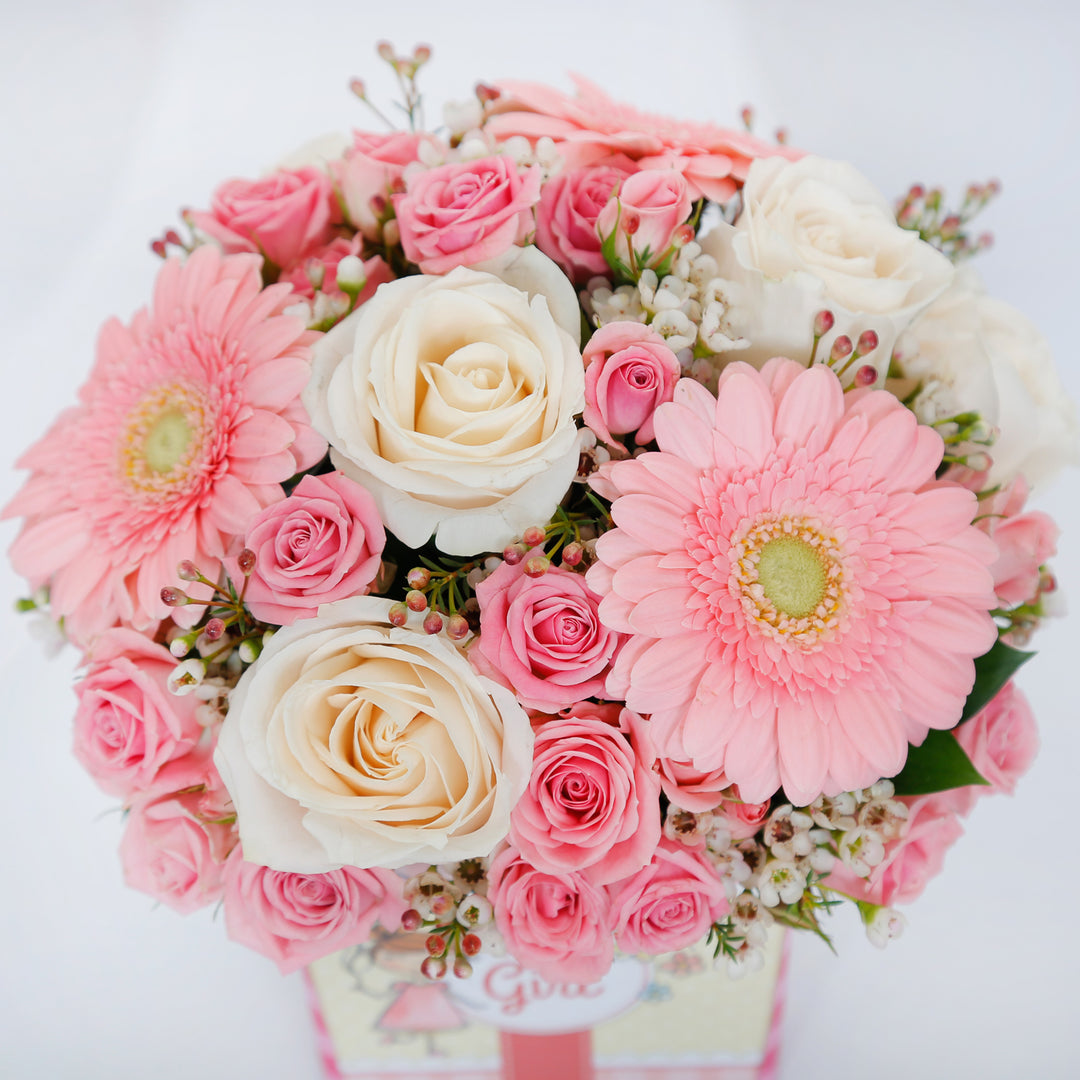 Charming Welcome Baby Girl Floral Arrangement in Square Vase