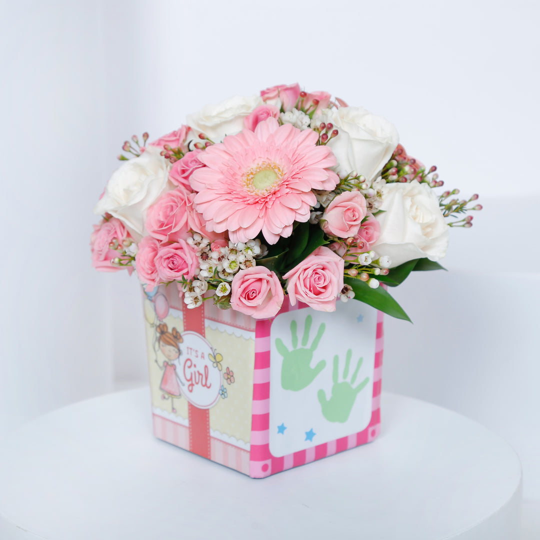 Charming Welcome Baby Girl Floral Arrangement in Square Vase