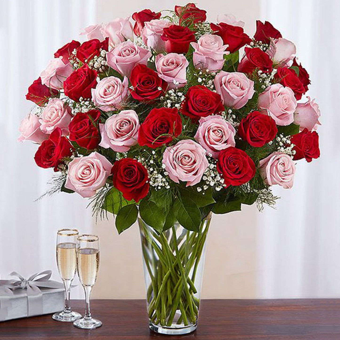 Luxurious Bouquet of 50 Vivid Red and Pink Roses in Elegant Glass Vase