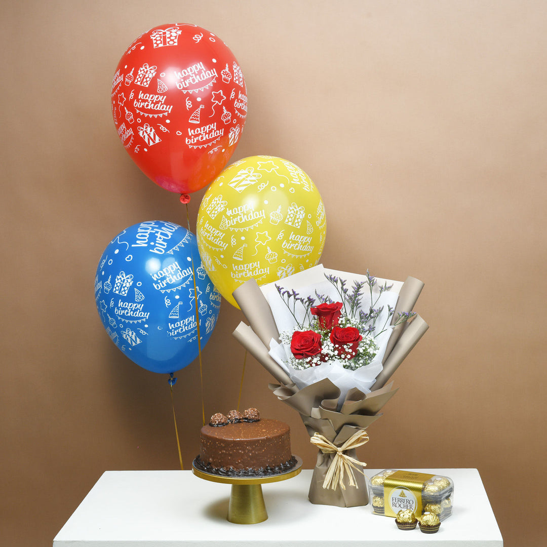 باقة مفاجأة عيد الميلاد الفاخرة: ورود، كعكة، بالونات وشوكولاتة