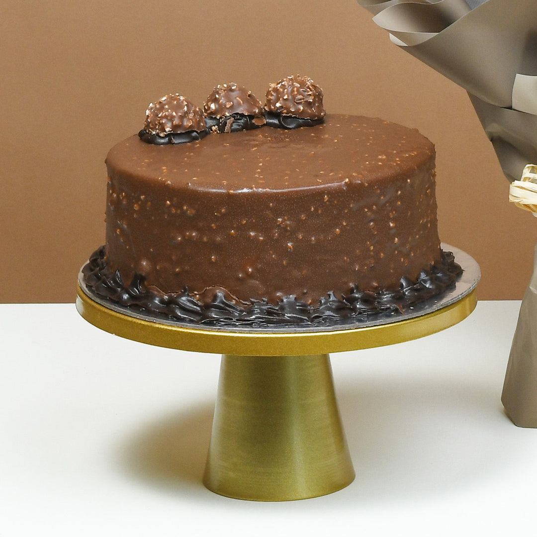 باقة الزهور الفاخرة مع كيكة فيريرو روشيه اللذيذة