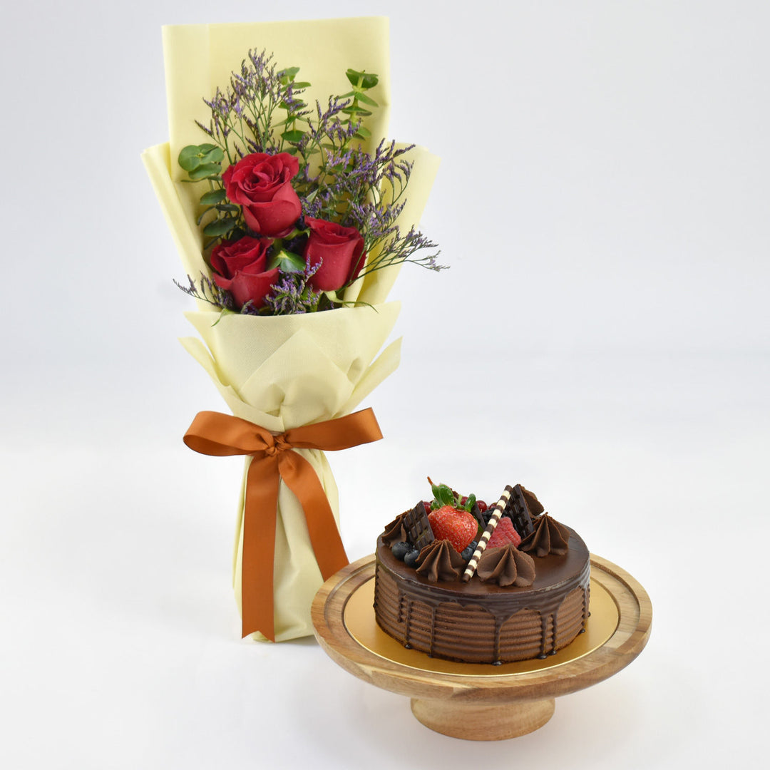 Decadent Chocolate Fudge Cake with Elegant Red Rose Bouquet