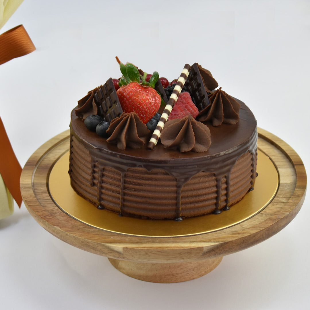 Decadent Chocolate Fudge Cake with Elegant Red Rose Bouquet