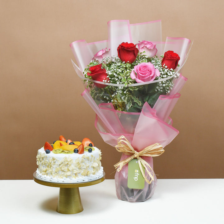 Elegant Bouquet of Blushing Roses with Delectable Fruit Cake