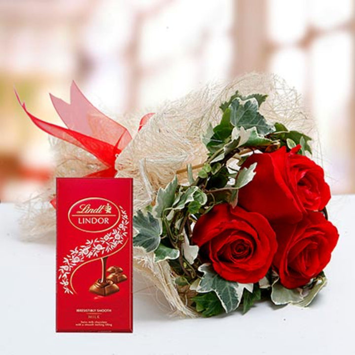 Luxurious Red Roses Bouquet with Lindt Milk Chocolate Delight